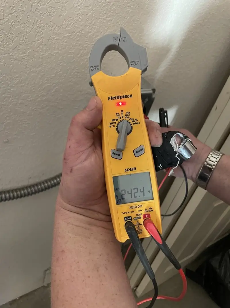 Voltage testing with clamp meter during Recessed Lighting Installation in Laguna Hills
